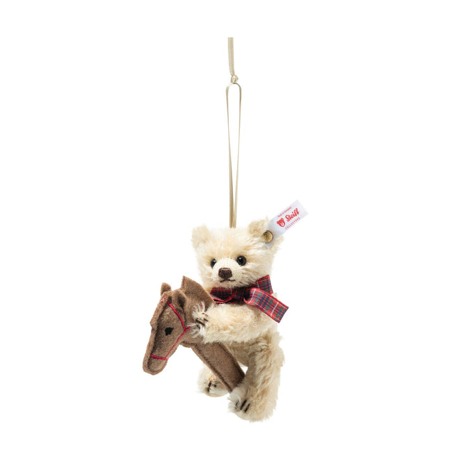 Teddy bear ornament on hobby horse